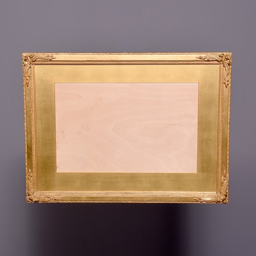 A Carved And Gilded Frame