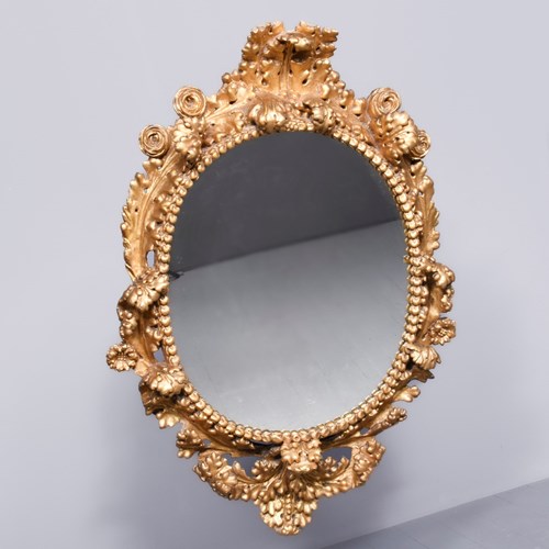 Carved And Gilded Oval Wall Mirror