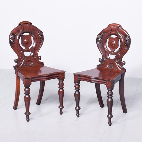 Pair Of Carved Mahogany Mid-Victorian Hall Chairs