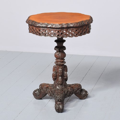 A Burmese Carved Occasional Table