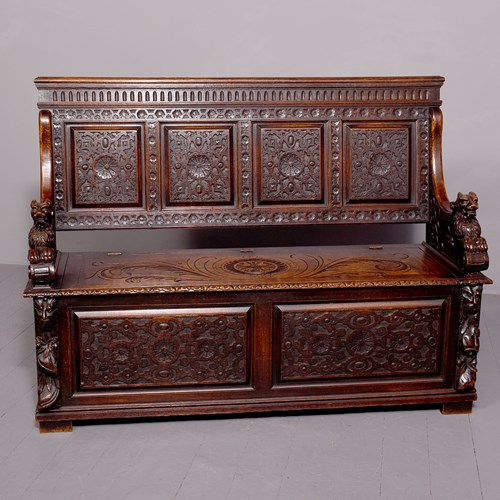 A Large Carved Oak Hall Bench