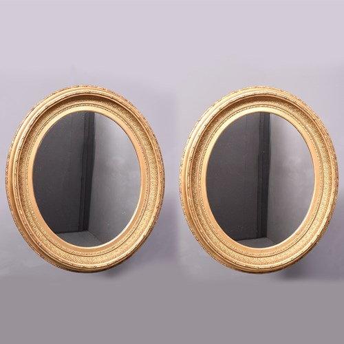 Pair Of Victorian Oval Gilded Mirrors