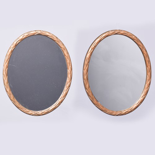 Pair Of Gilded Gesso Oval Mirrors