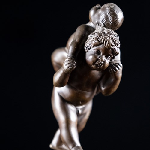 Bronze Putti Playing Piggyback After Leonhard Kern (1588-1662)