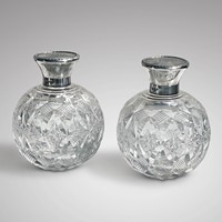 Pair of Cut Glass Perfume Bottles with Silver Tops