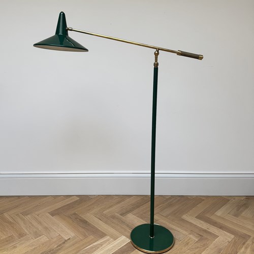 An Adjustable Green Metal And Brass Floor Lamp