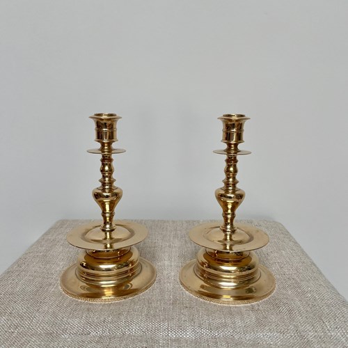 A Pair Of Brass Candle Holders