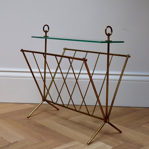 A Brass And Glass Magazine Rack