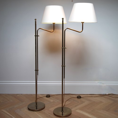 A Pair Of Adjustable Brass Floor Lamps