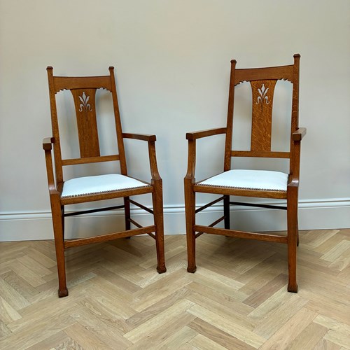 A Pair Of Arts And Crafts Arm Chairs