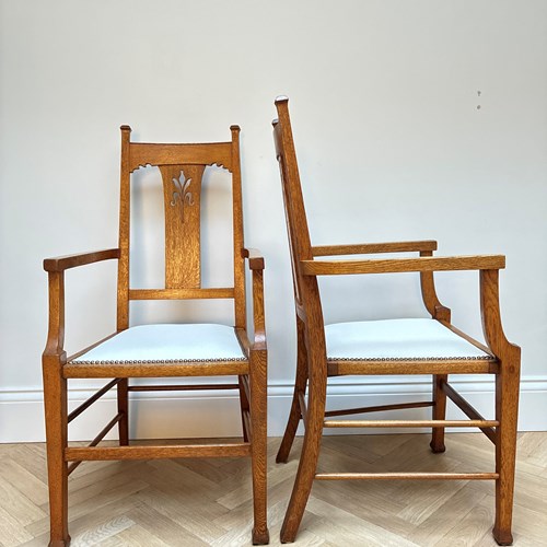 A Pair Of Arts And Crafts Arm Chairs