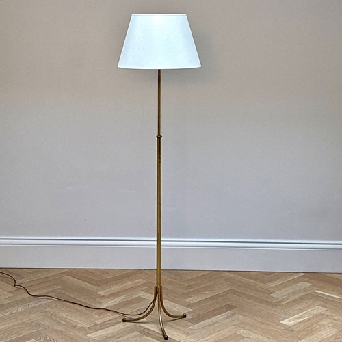 An Adjustable Brass Floor Lamp