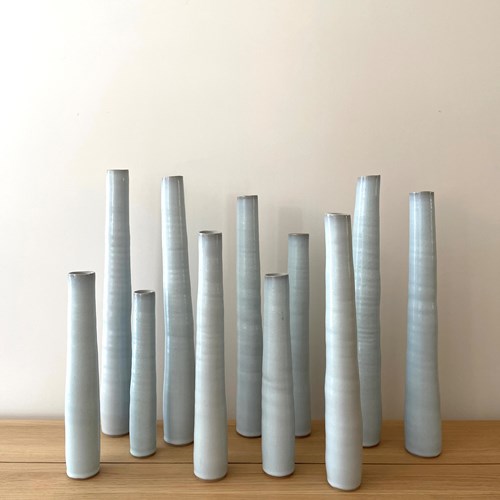 Set Of Eleven Cylindrical Bottles By Rupert Spira 