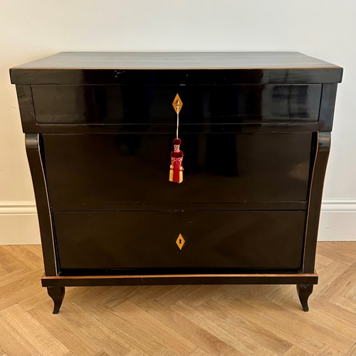 An Ebonized Chest Of Drawers