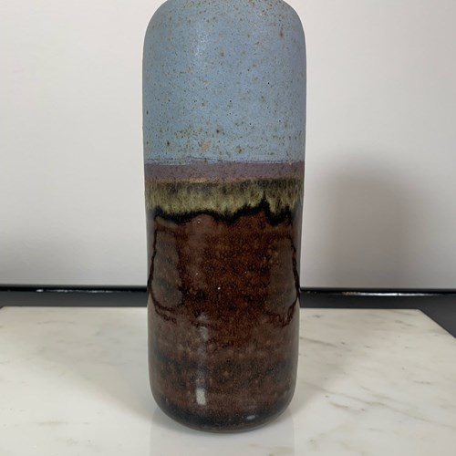 A Tall Cylindrical Glazed Vase