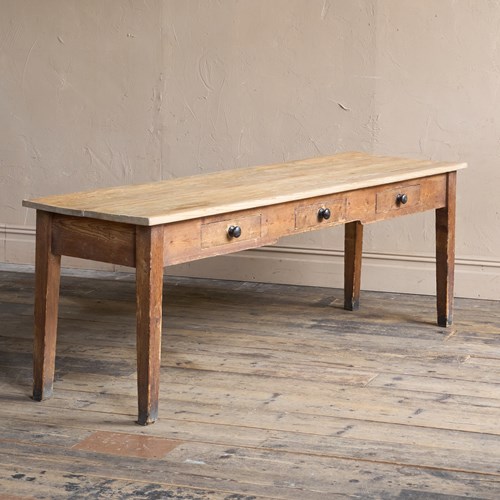 A Large Pine Scullery Table With Drawers