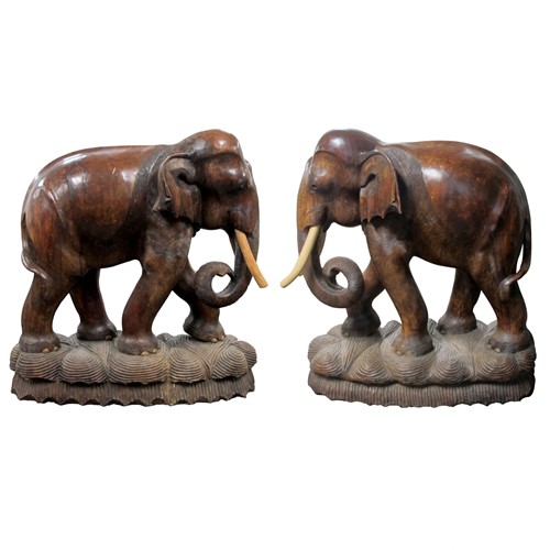 A pair of carved wood elephants sculptures, 20th C