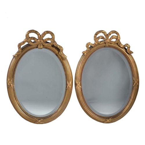 Pair Of Oval Gilt Mirrors