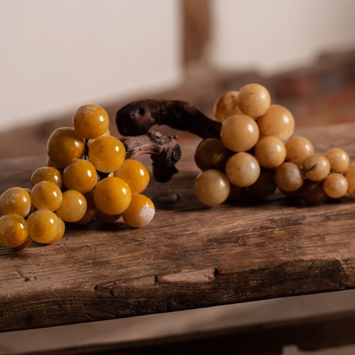 Alabaster and wood stemmed decorative grapes