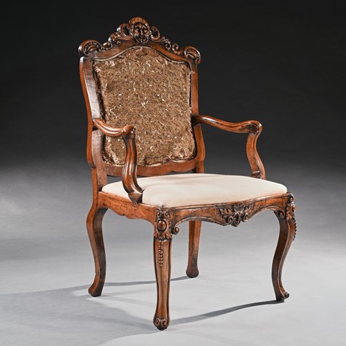 Mid 18Th Century Italian Rococo Armchair In Walnut With Extravagantly Carved Hea