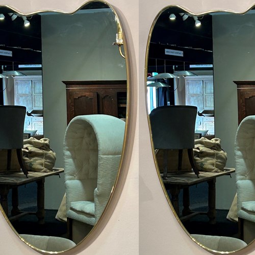 Pair Of Brass Framed Shield Mirrors