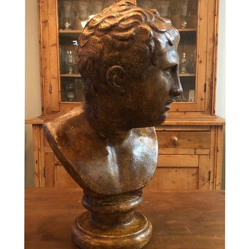 An early 20thC plaster bust of Hermes 