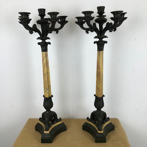 A pair of early 19thC bronze and sienna Candleabra