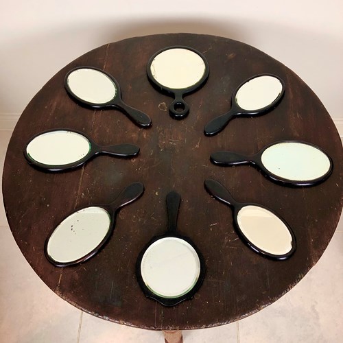 A Collection Of 8 Ebony Mirrors 