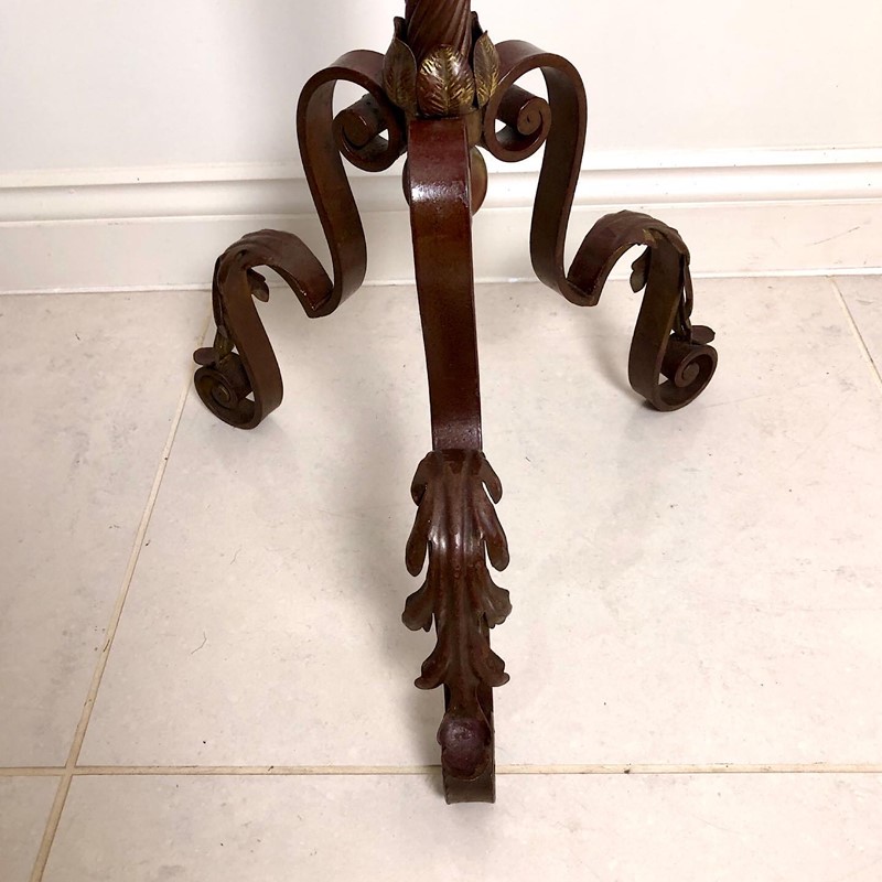 A large wrought iron candle stand -marchand-antiques-4cfa4766-2b85-46dd-8b60-f1be9f12a12f-main-638026410839290143.jpeg