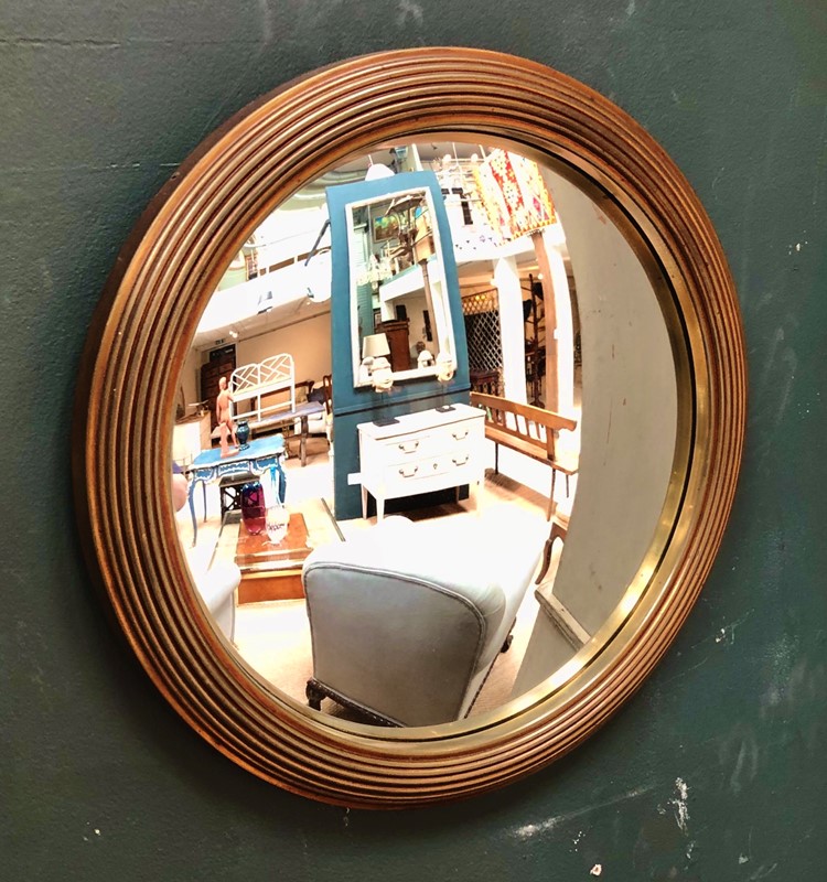 A brass framed convex mirror -marchand-antiques-bf34390c-ac89-4223-bafb-0631f8f484d5-main-637265329145723139.jpeg