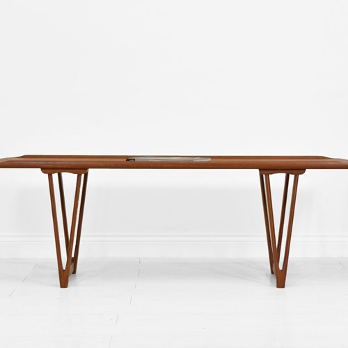 Mid Century Danish Teak Coffee Table On V Shape Supports And Lipped Top Edge