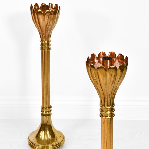 Two Brass Floor Standing Candle Stands With Flared Scalloped Uppers 