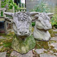 pair of reconstituted stone bulls heads 