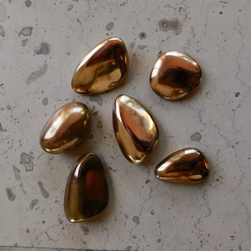 six bronze sculptural Pebbles by Monique Gerber 