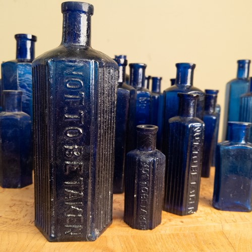 C1880 A collection of 30 Blue Glass Poison Bottles
