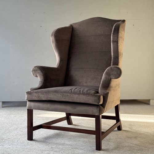 C1750 An English George 111 Period Wing Chair In Velvet.