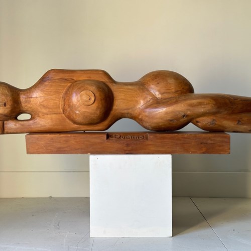 A Carved Wood Recumbent Sculpture Of A Women 1981