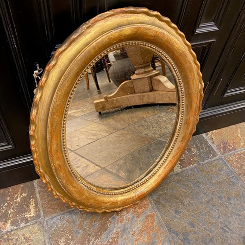 C1880 A Small Oval Gilt Mirror