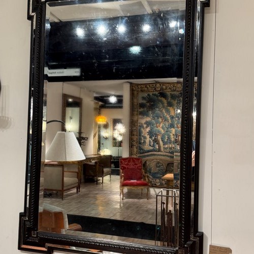 C1840 A French Ebonised Cushion Mirror