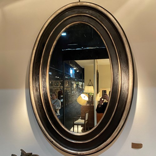 C1870 A French Napoleon 3 Ebonised & Silvered Oval Mirror