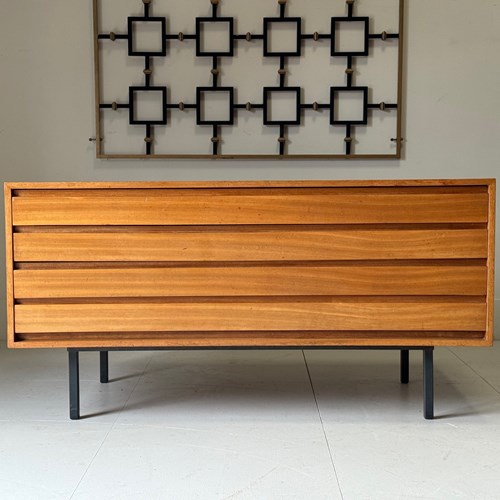 C1950's An English Teak Wide Chest Of Drawers