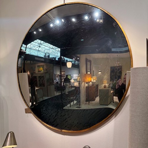 C1950 An Eastern European Large Convex Mirror In Gilt Iron Frame