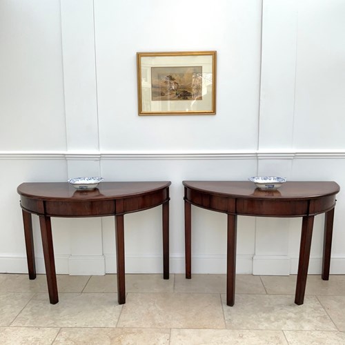 A Pair Of Demi Lune Console Tables 