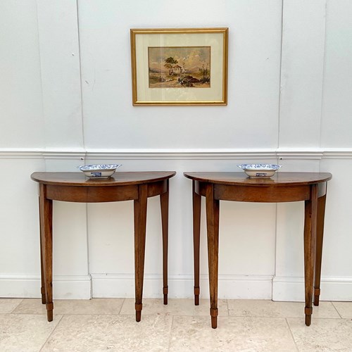 A Pair Of Walnut Demi Lune Console Tables 