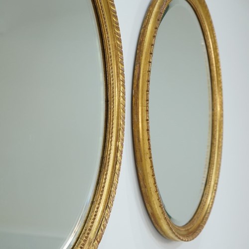 Pair Of Oval Giltwood Mirrors
