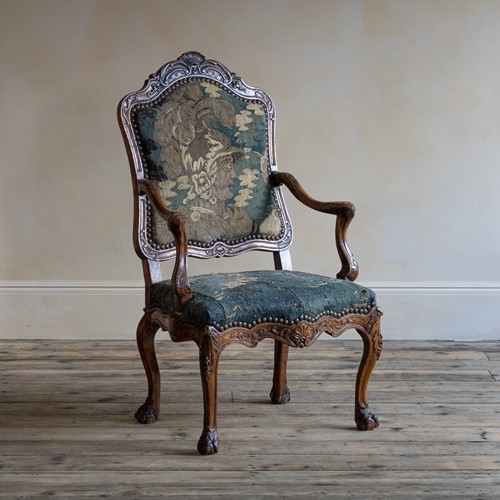 A Louis XV carved walnut fauteuil