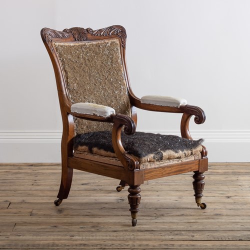 A 19th century carved mahogany arm chair