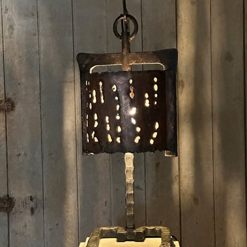 A Brutalist Copper And Iron Lamp
