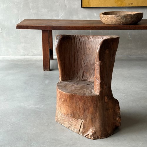 A Primitive Elm Dugout Chair