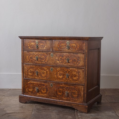 A Walnut, Oak And Seaweed Marquetry Chest Of Drawers